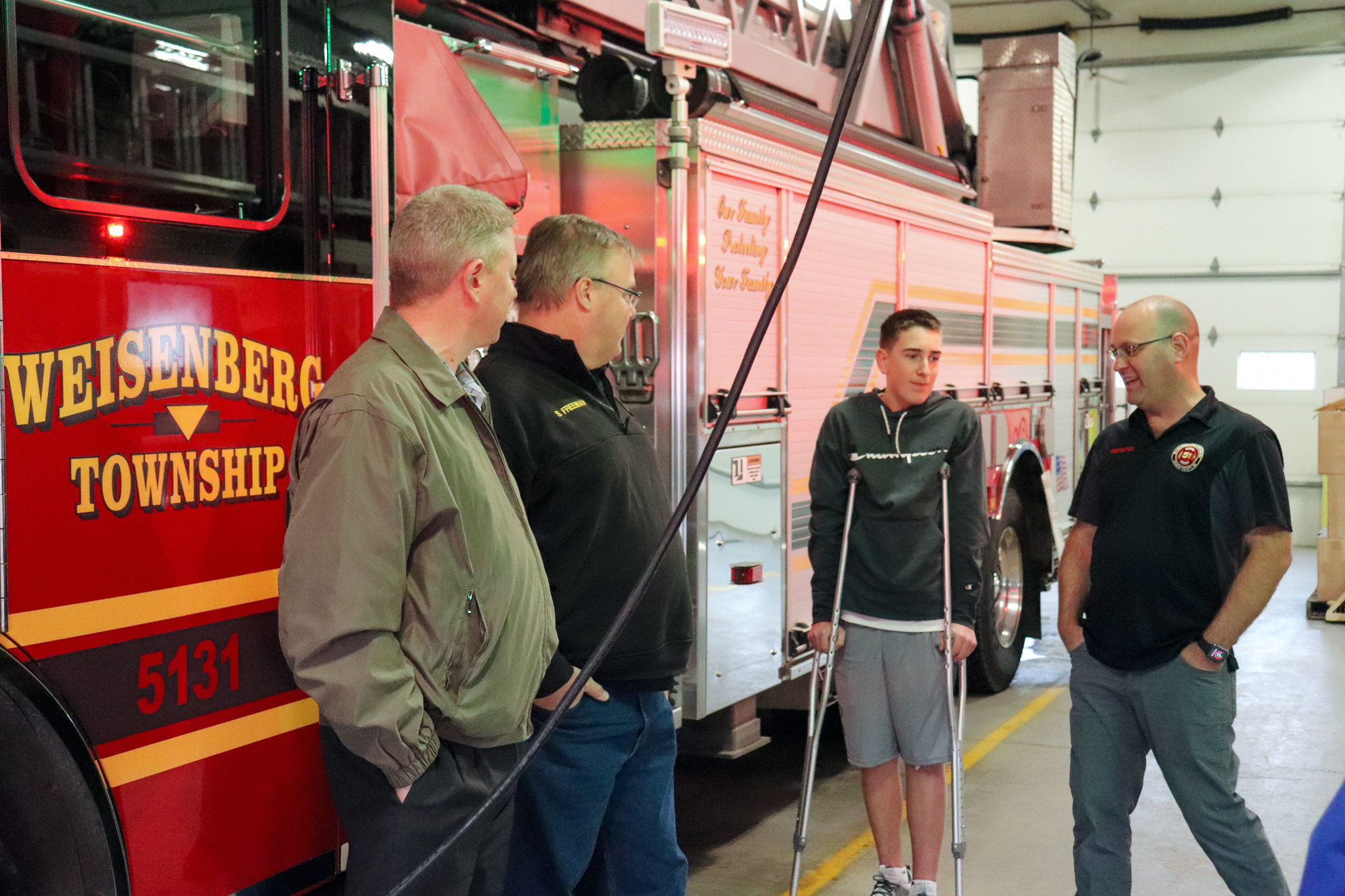 Dave Sherwin talking with fire department members